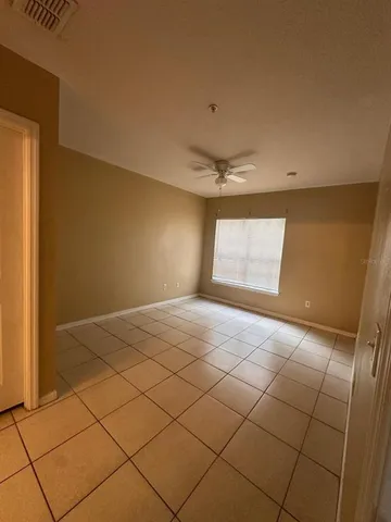 a bathroom with a toilet and a mirror