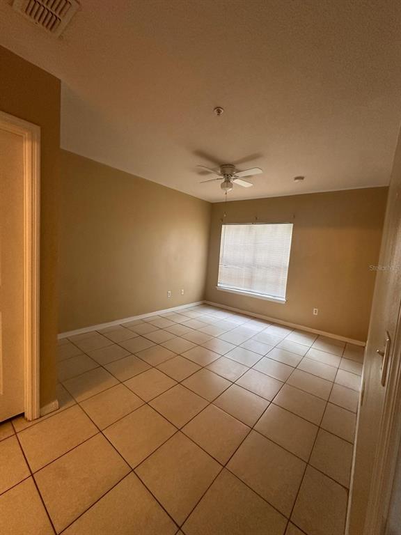 4364 South Kirkman Road, Unit 313 Orlando, FL 32811 - Photo 20 of 27 a view of an empty room and window