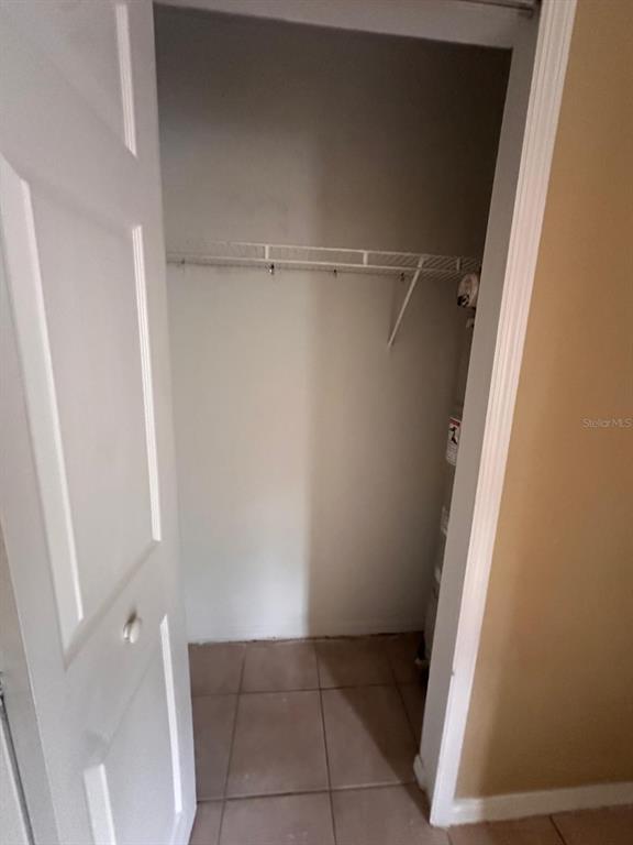 4364 South Kirkman Road, Unit 313 Orlando, FL 32811 - Photo 7 of 27 a view of an empty walk in closet