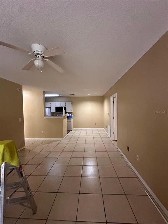 4364 South Kirkman Road, Unit 313 Orlando, FL 32811 - Photo 10 of 27 a view of a livingroom with a fireplace