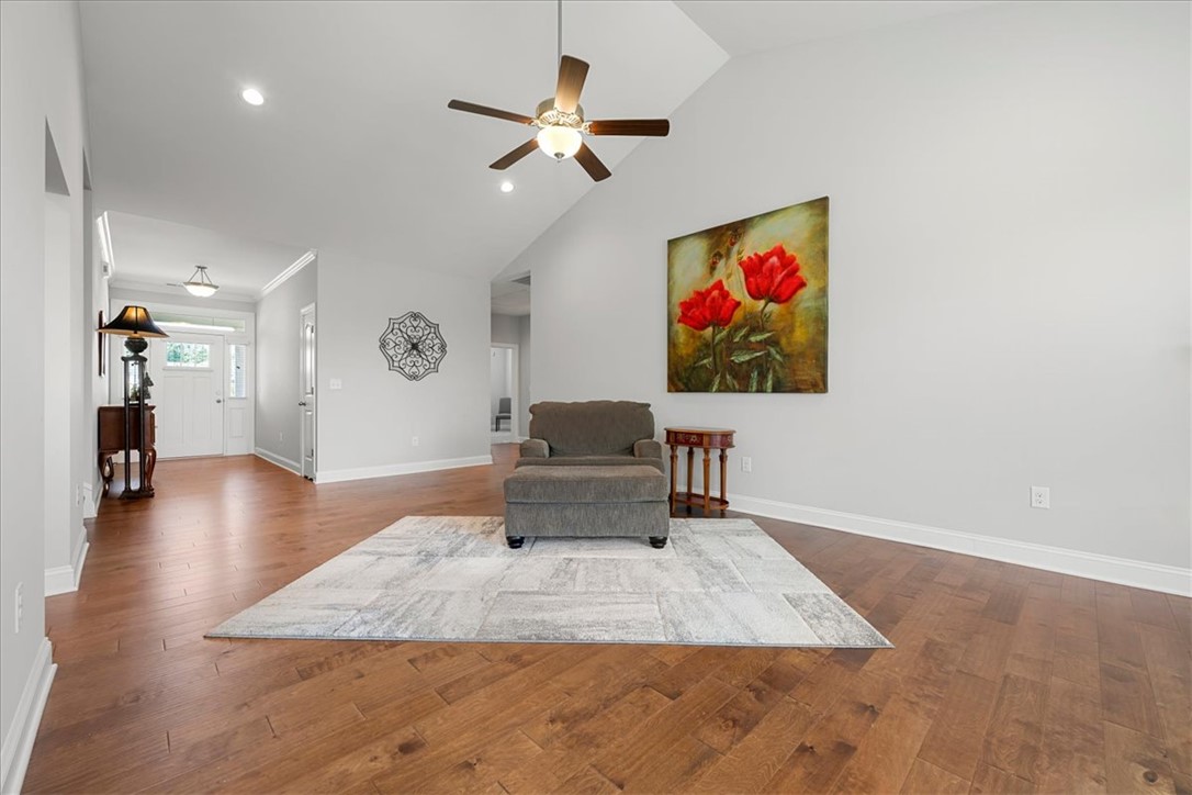 21 Barron Glenn Way Anderson, SC 29621 - Photo 8 of 48 This generous living room features warm hardwood floors and a lofty Cathedral Ceiling, creating an open and welcoming space.