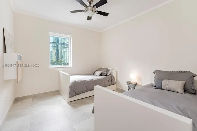 a bedroom with a bed and a cabinets