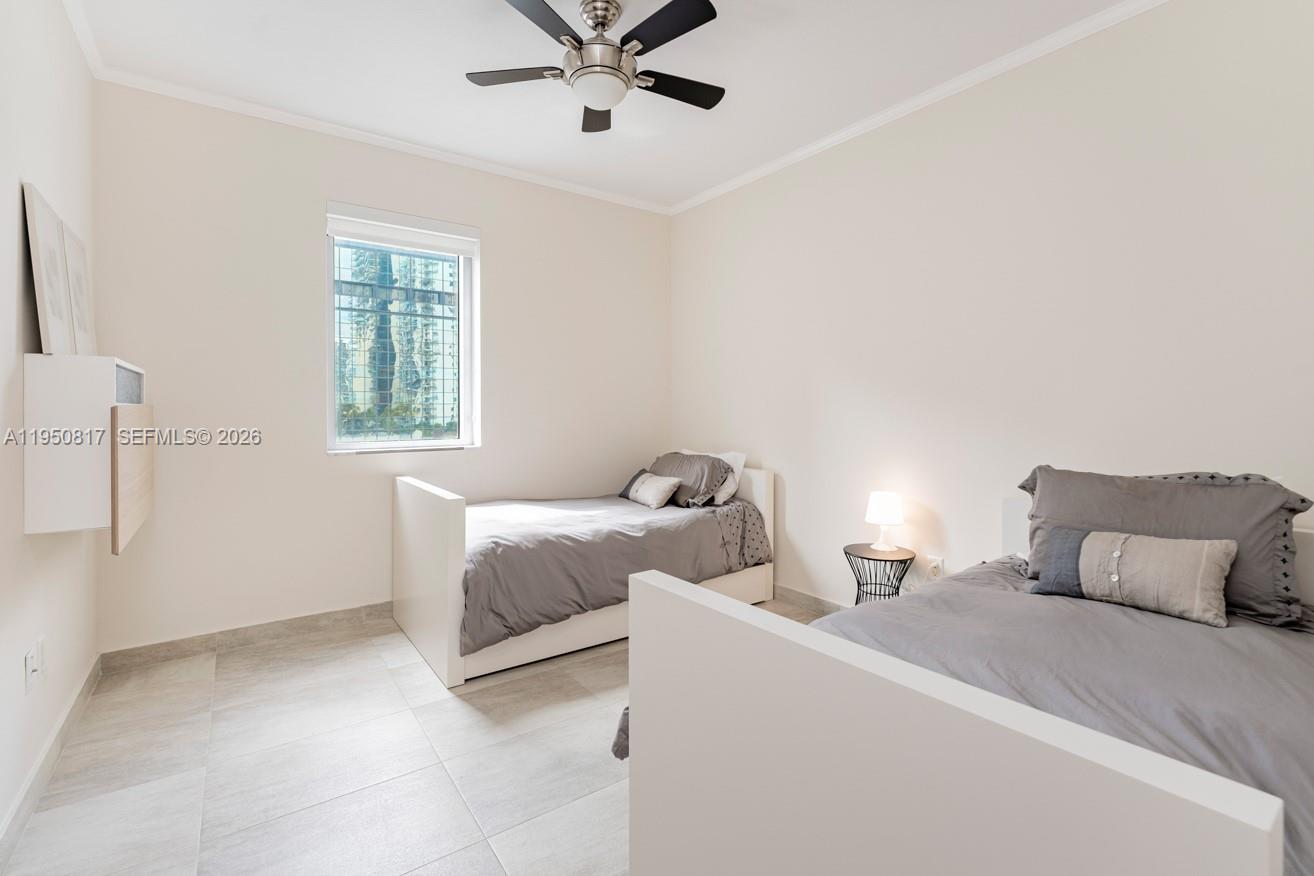 1060 Brickell Avenue, Unit 1507 Miami, FL 33131 - Photo 12 of 56 a bedroom with two beds and a window