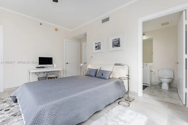 a bathroom with a bathtub shower sink mirror and toilet