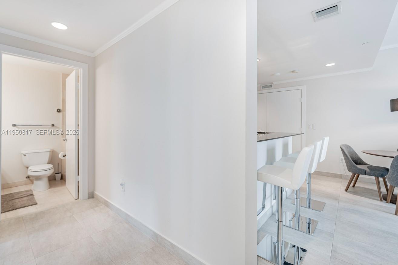 1060 Brickell Avenue, Unit 1507 Miami, FL 33131 - Photo 20 of 56 a view of an empty room with a bathroom