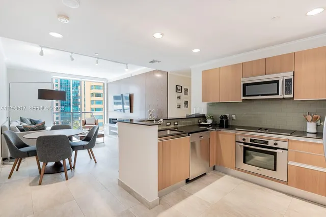 a kitchen with a sink stove and refrigerator