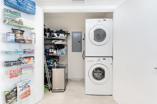 a kitchen with kitchen island cabinets and refrigerator
