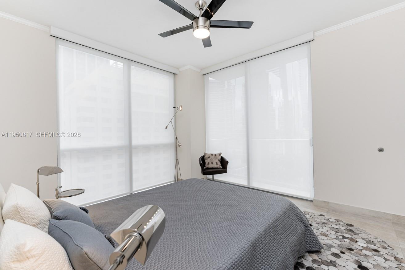 1060 Brickell Avenue, Unit 1507 Miami, FL 33131 - Photo 3 of 56 a bedroom with a bed and window
