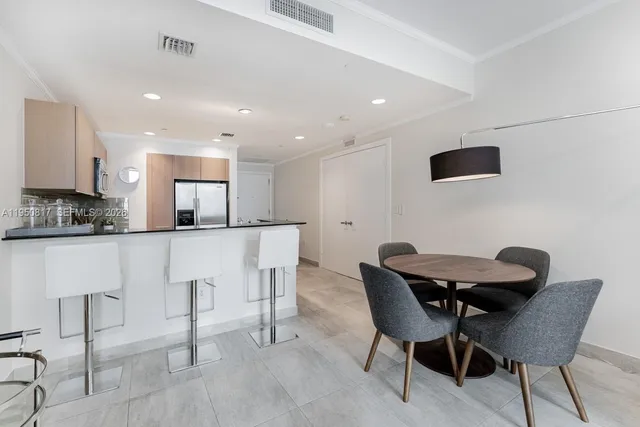 a view of a livingroom with furniture and floor to ceiling window