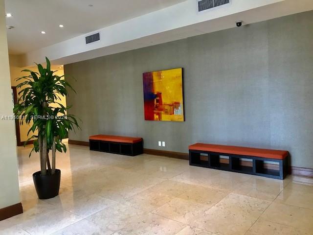 1060 Brickell Avenue, Unit 1507 Miami, FL 33131 - Photo 33 of 56 a lobby room with furniture and potted plant