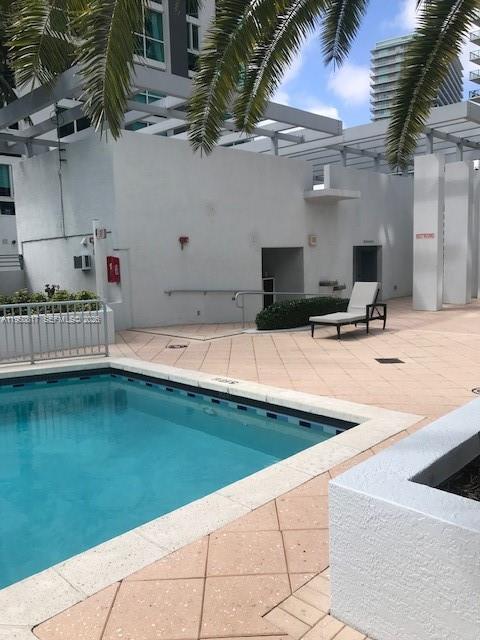 1060 Brickell Avenue, Unit 1507 Miami, FL 33131 - Photo 40 of 56 a view of a outdoor space with swimming pool