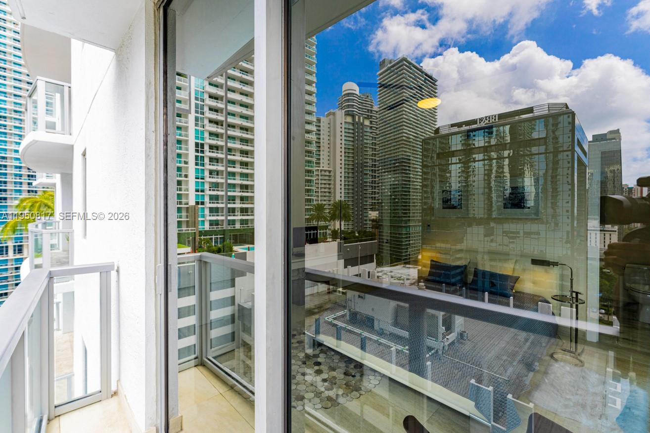 1060 Brickell Avenue, Unit 1507 Miami, FL 33131 - Photo 47 of 56 a bathroom with a sink and a mirror