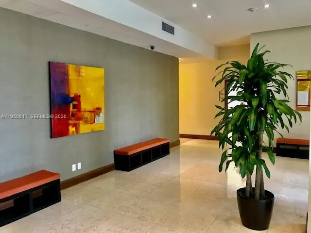 a view of a dining room with furniture and window