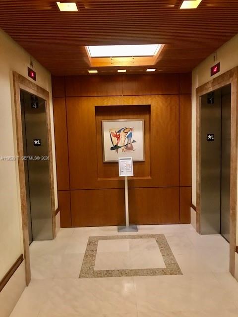 1060 Brickell Avenue, Unit 1507 Miami, FL 33131 - Photo 50 of 56 a bedroom with a bed and a painting on the wall