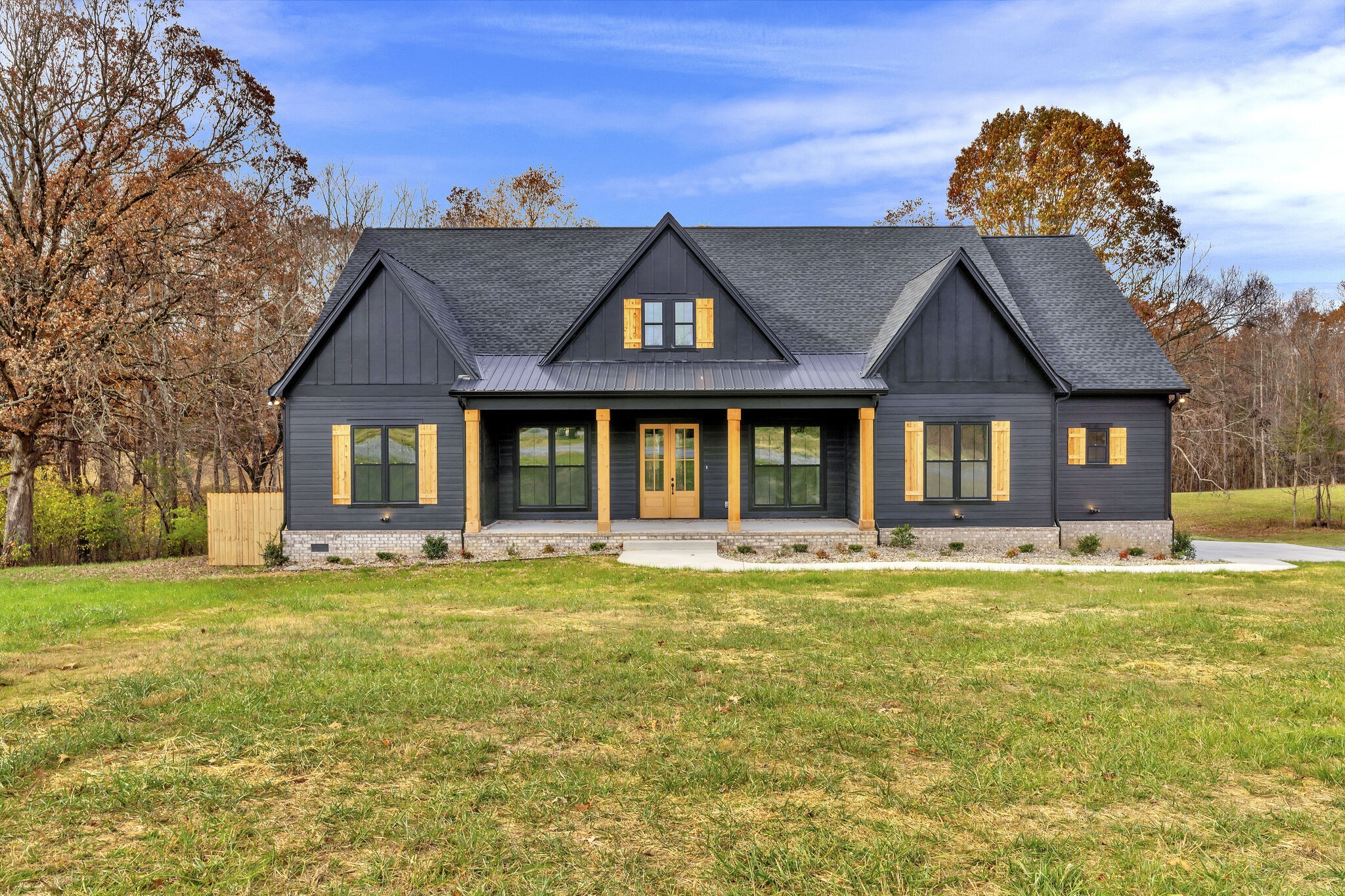 3435 Highway 25 Cottontown, TN 37048 - Photo 1 of 52 a view of a house with a big yard and large trees