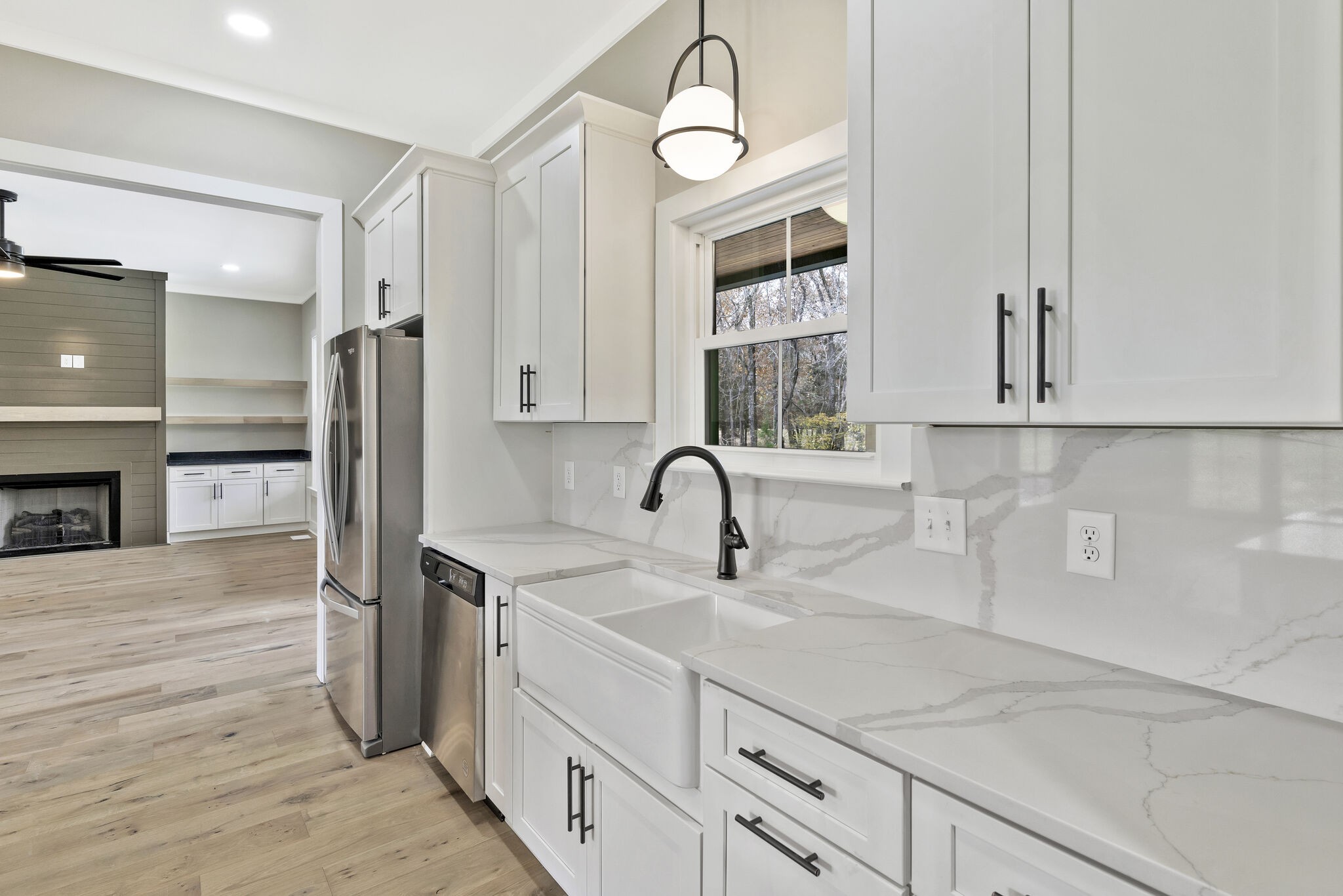 3435 Highway 25 Cottontown, TN 37048 - Photo 16 of 52 a kitchen with stainless steel appliances a sink and cabinets