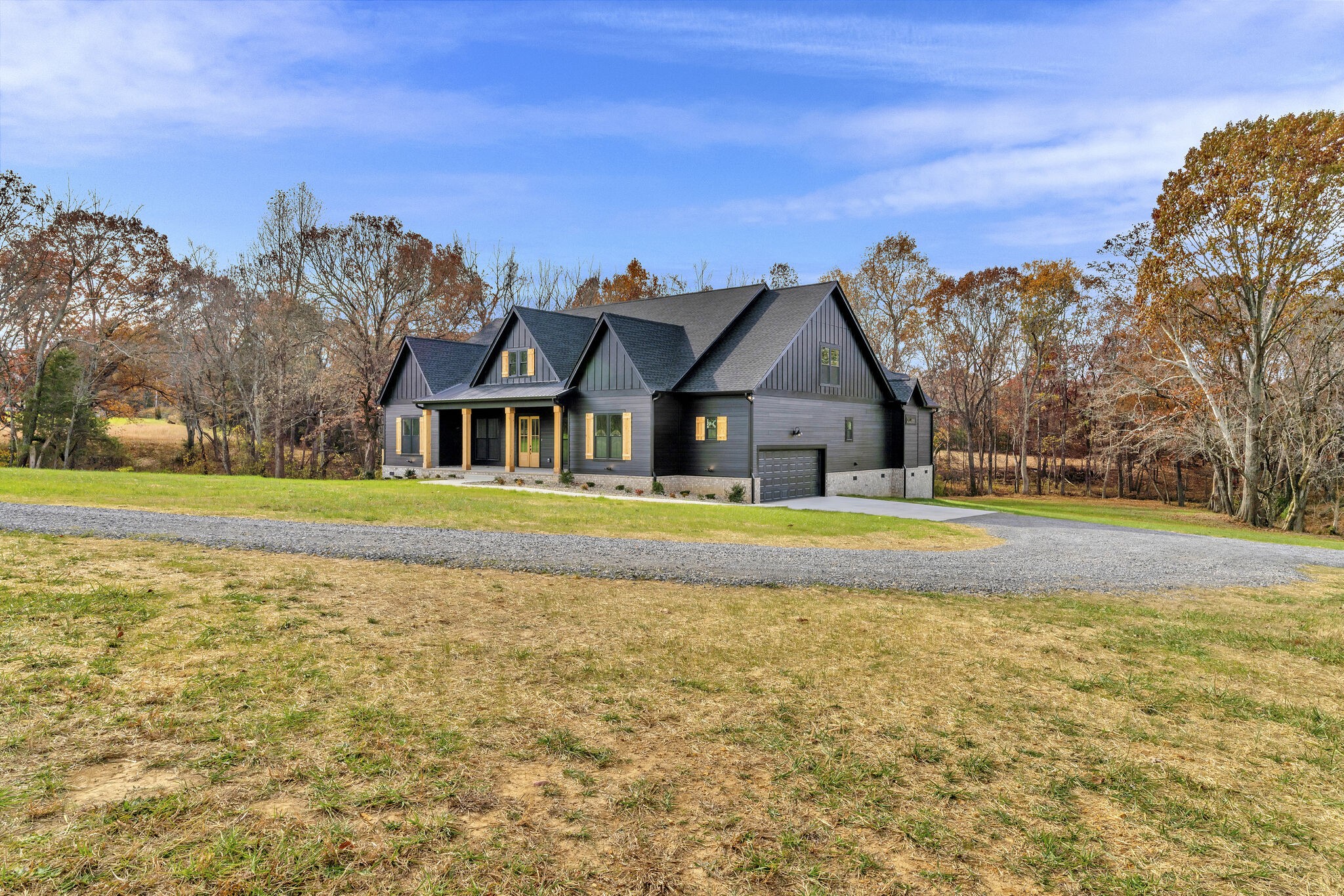 3435 Highway 25 Cottontown, TN 37048 - Photo 2 of 52 a front view of house with yard and trees in the background