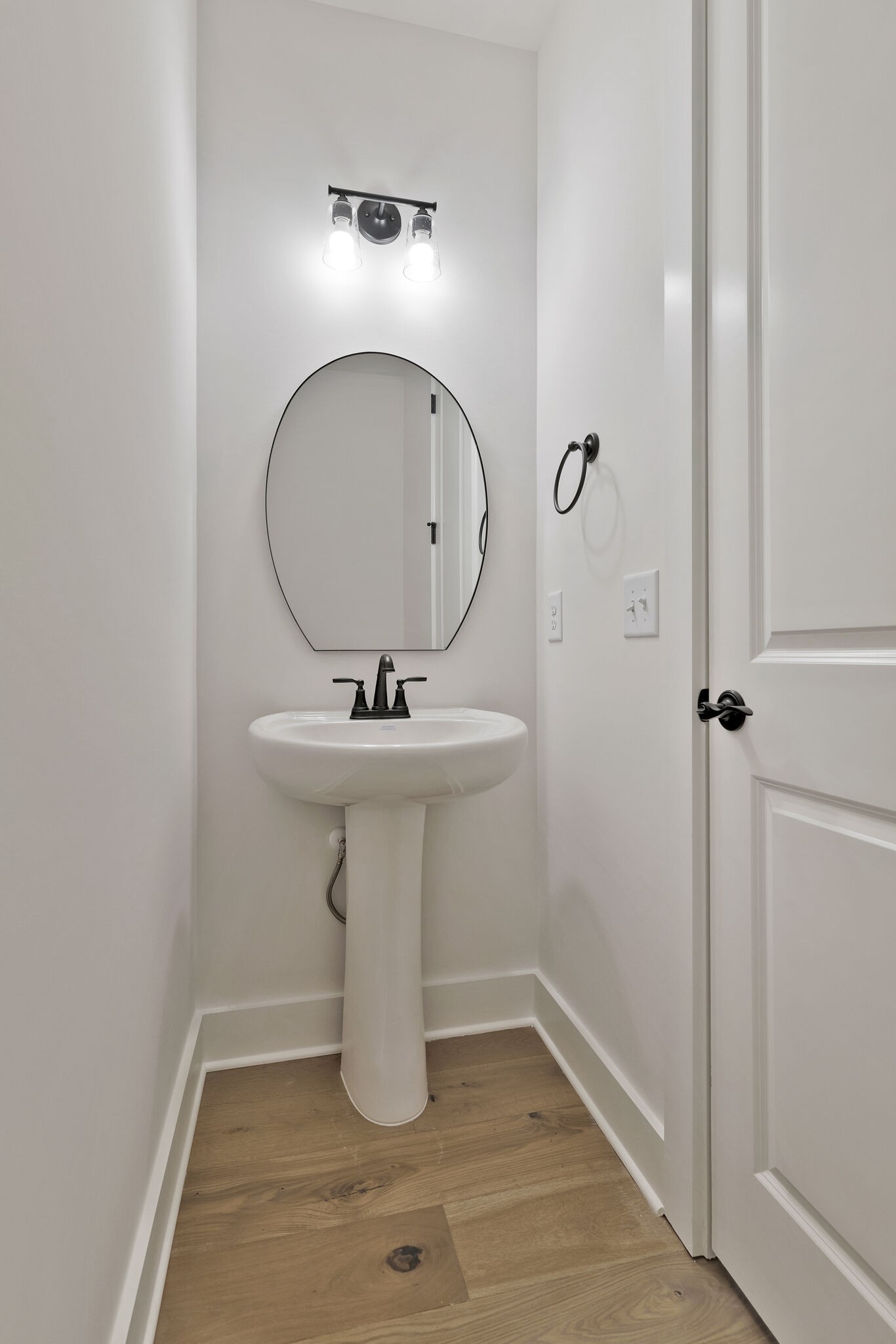 3435 Highway 25 Cottontown, TN 37048 - Photo 29 of 52 a bathroom with a sink and mirror