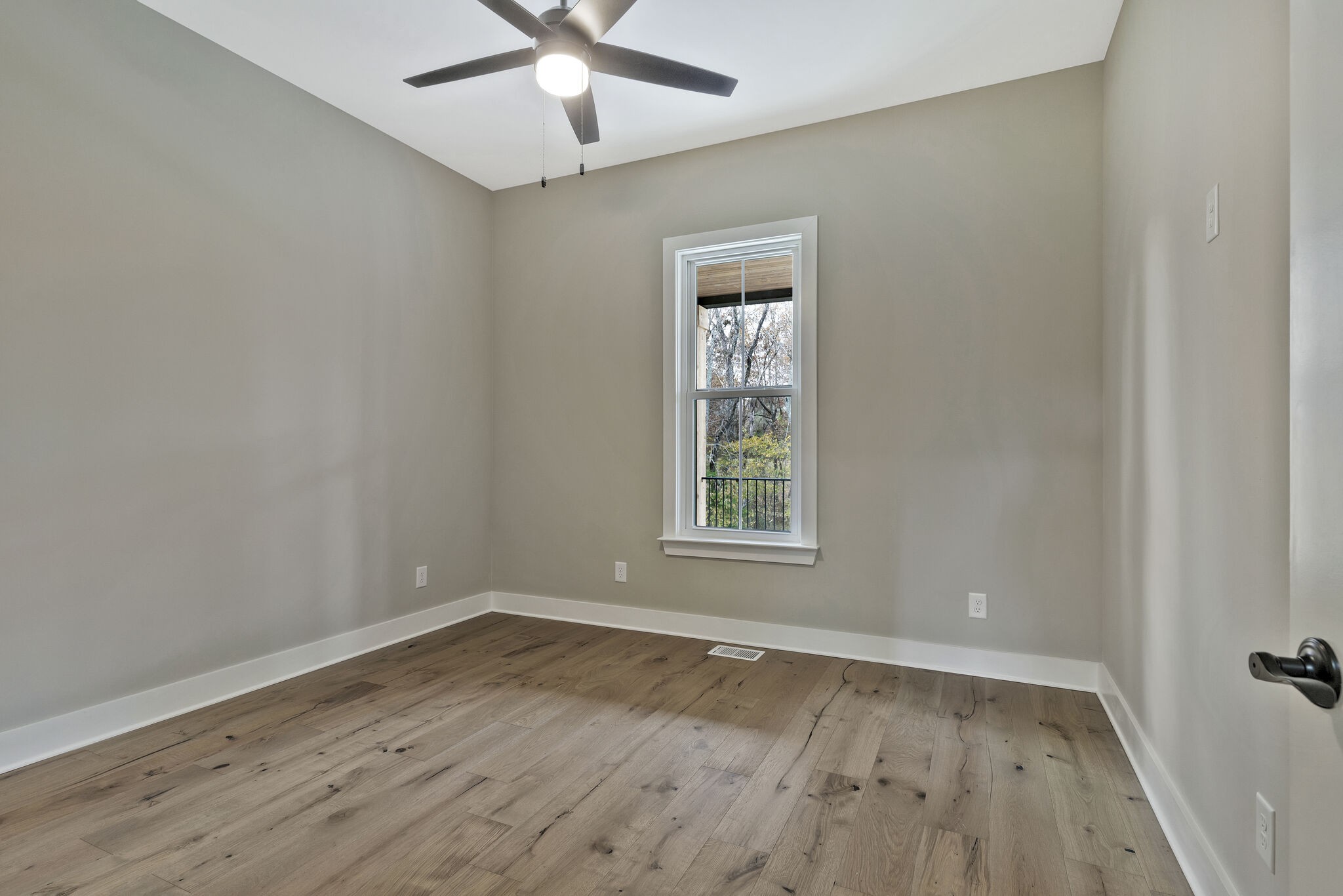 3435 Highway 25 Cottontown, TN 37048 - Photo 31 of 52 an empty room with a window and wooden floor