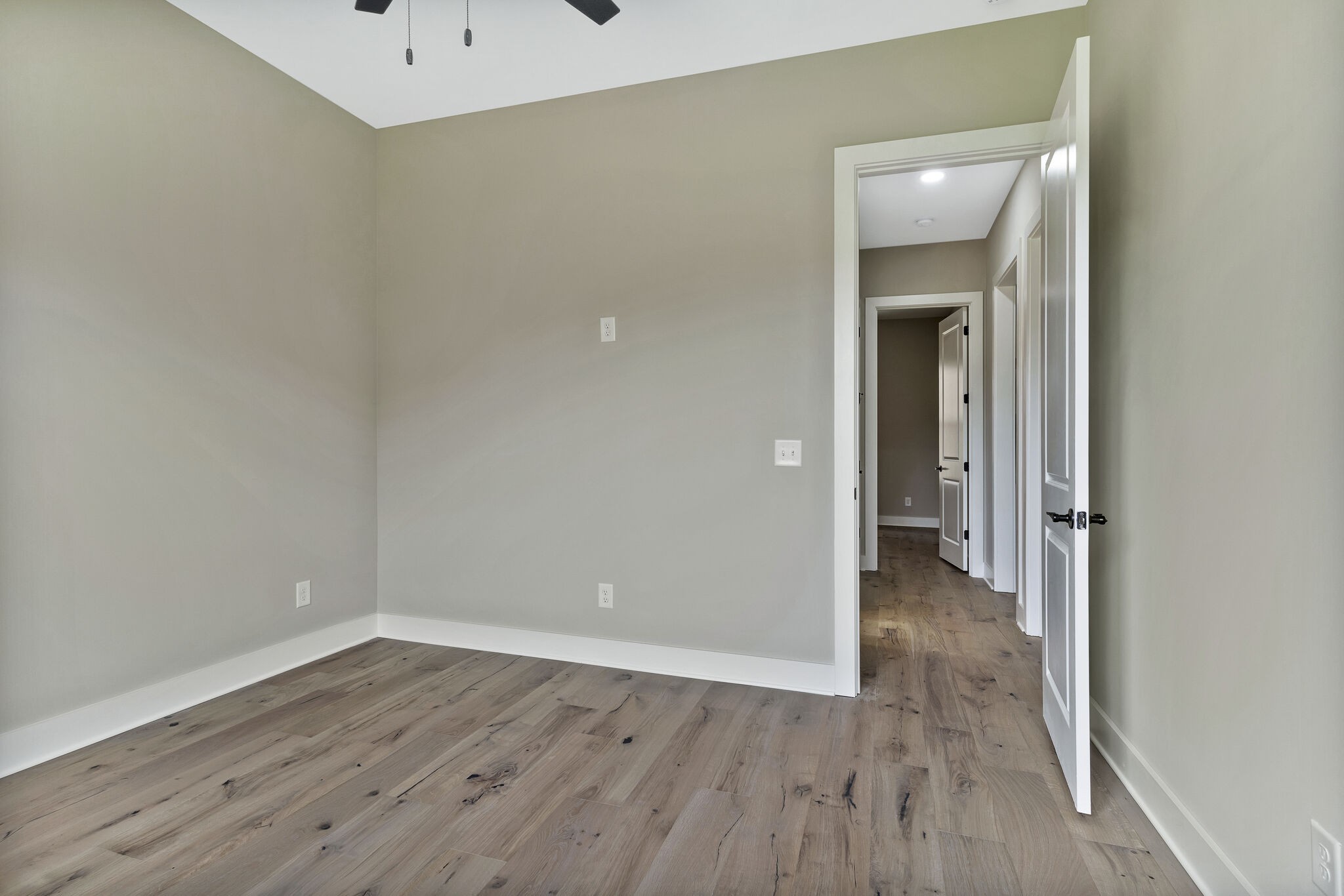 3435 Highway 25 Cottontown, TN 37048 - Photo 34 of 52 wooden floor in a hall with an empty room