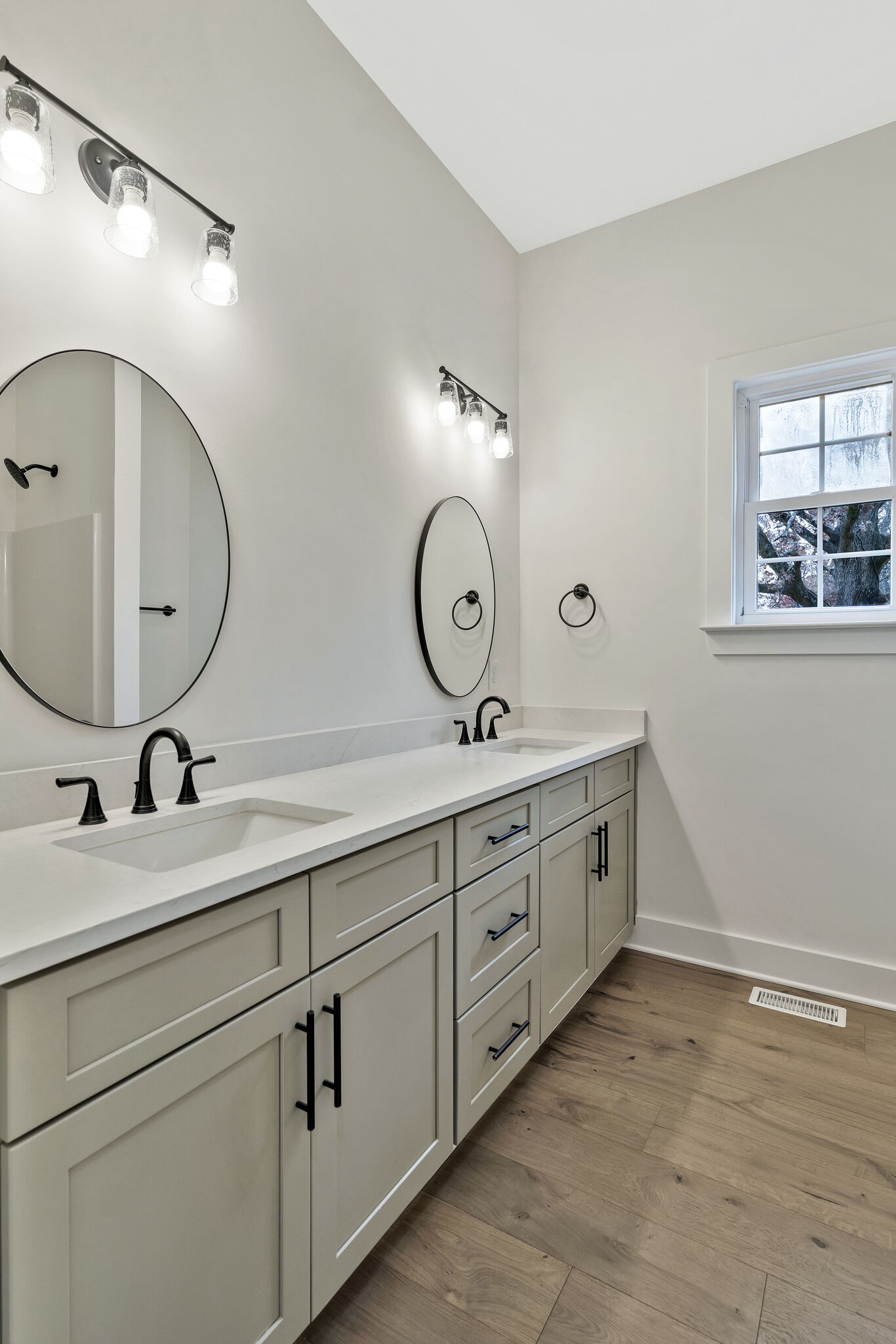 3435 Highway 25 Cottontown, TN 37048 - Photo 35 of 52 a bathroom with a double vanity sink and a mirror