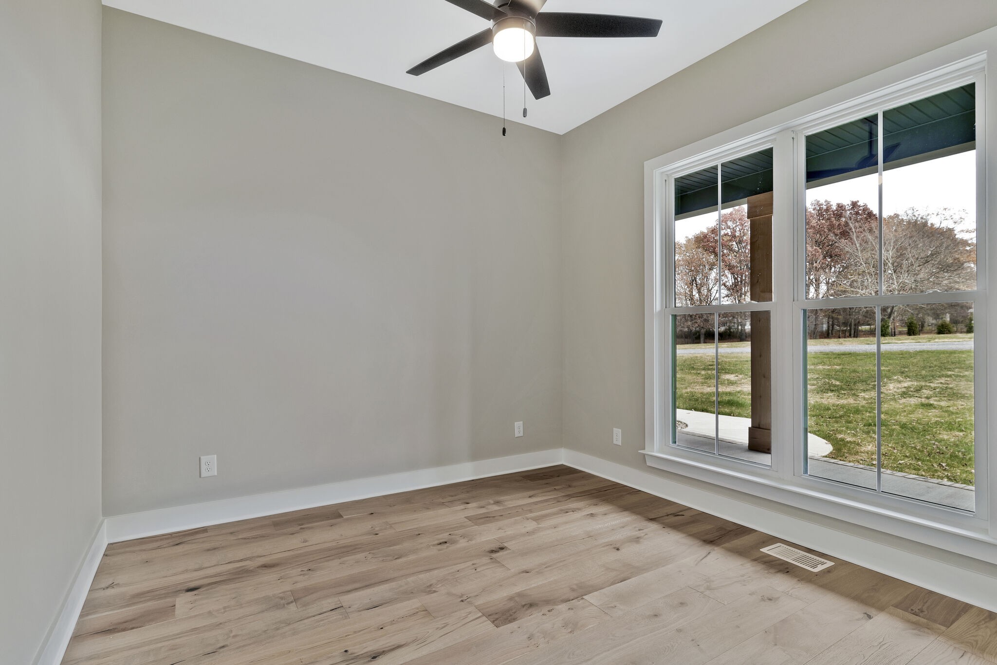 3435 Highway 25 Cottontown, TN 37048 - Photo 37 of 52 an empty room with a large window and wooden floor
