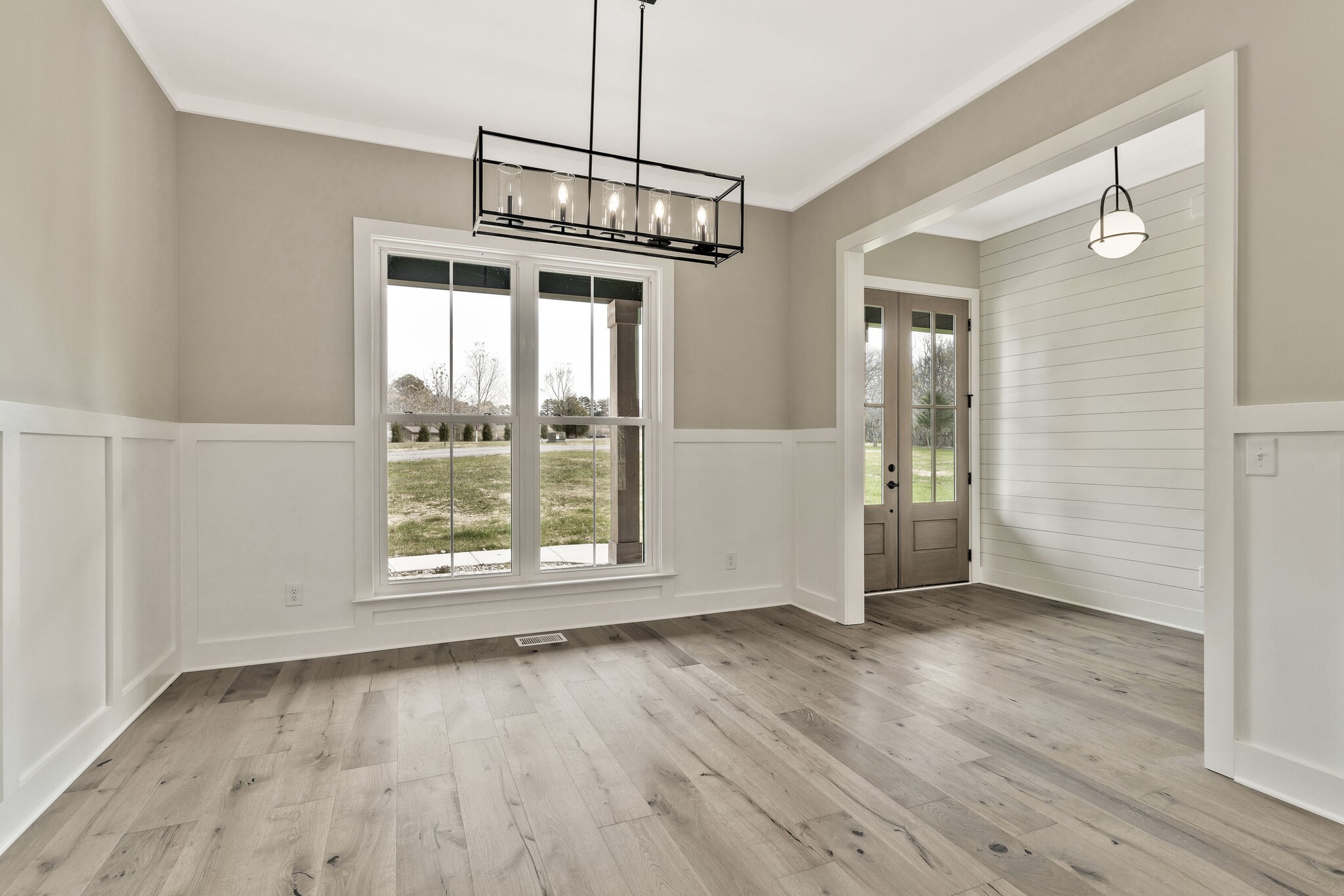 3435 Highway 25 Cottontown, TN 37048 - Photo 9 of 52 a view of an empty room with wooden floor and a window