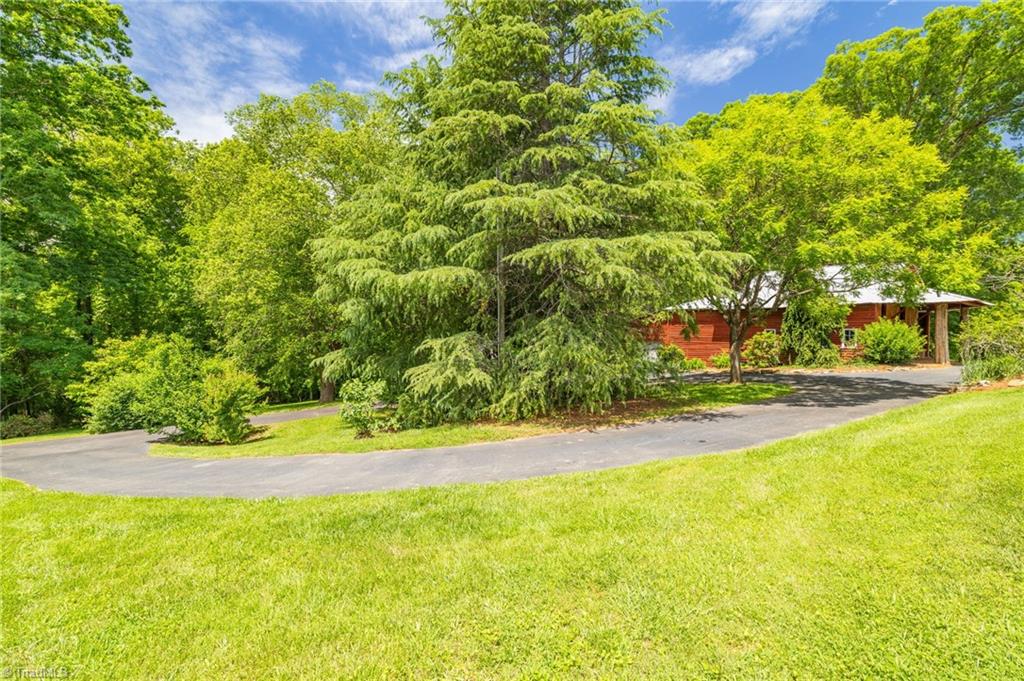1134 Edwards Farm Road King, NC 27021 - Photo 34 of 50 Private paved drive from main road leads up to this tucked away paradise and wraps around for easy access