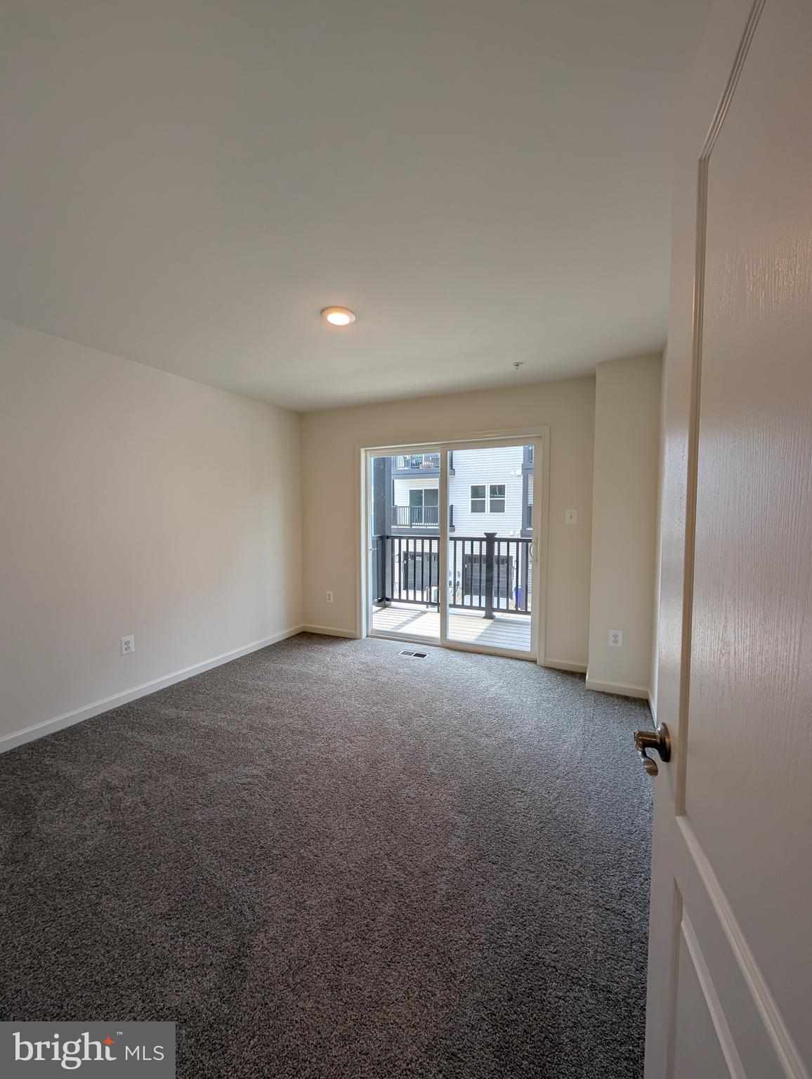 9985 A Justify Run Laurel, MD 20723 - Photo 11 of 33 a view of an empty room with a window