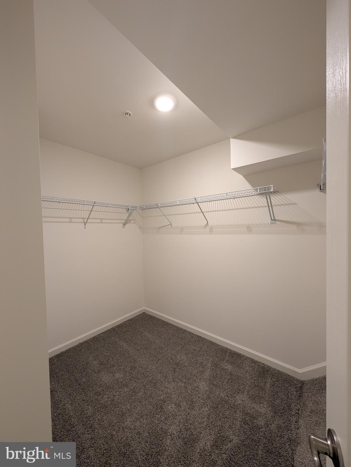 9985 A Justify Run Laurel, MD 20723 - Photo 16 of 33 a view of a room with racks on the wall