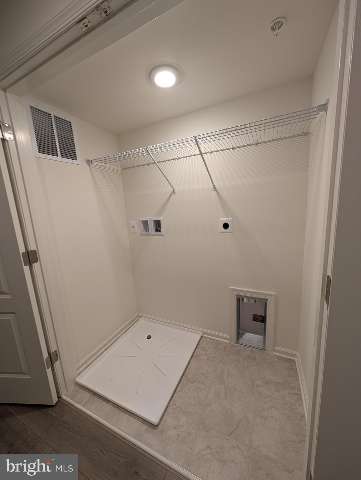 9985 A Justify Run Laurel, MD 20723 - Photo 21 of 33 a view of a room with racks on the wall