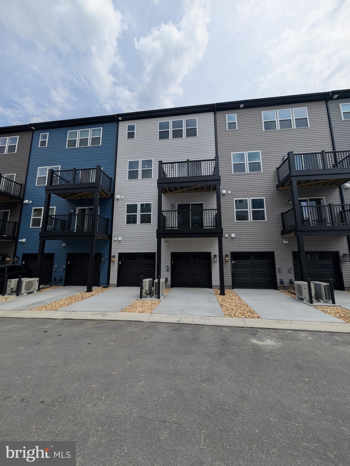 9985 A Justify Run Laurel, MD 20723 - Photo 25 of 33 a front view of building with street