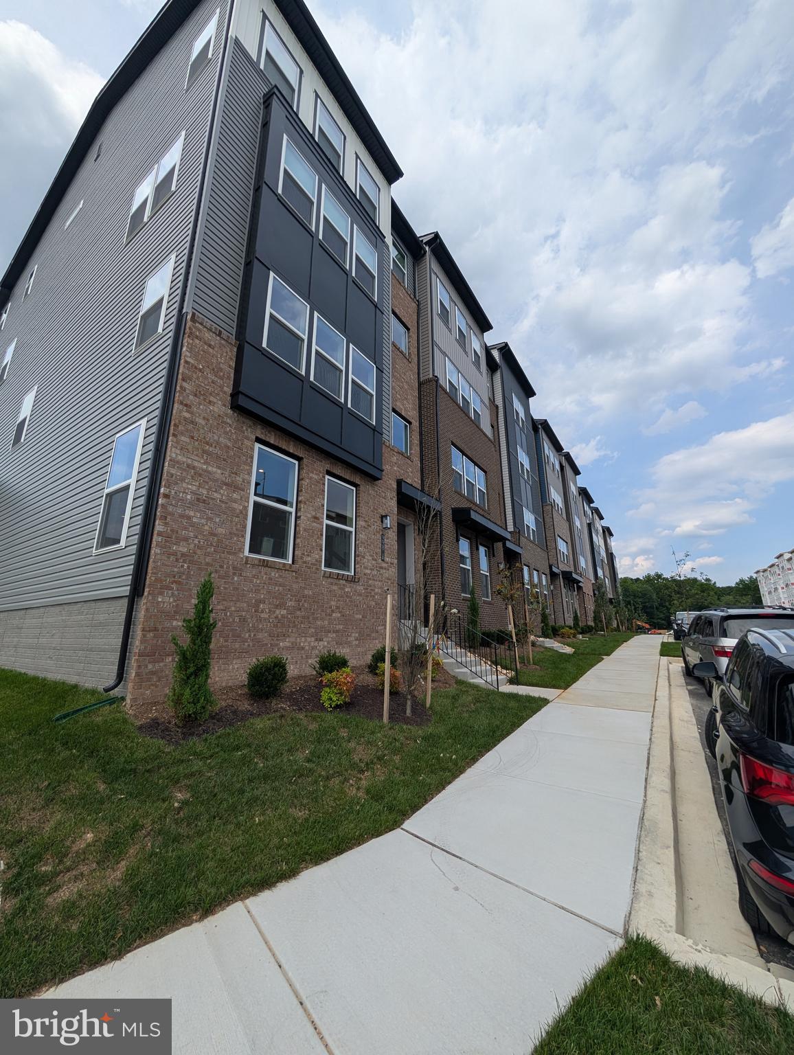 9985 A Justify Run Laurel, MD 20723 - Photo 27 of 33 a view of a building with a yard