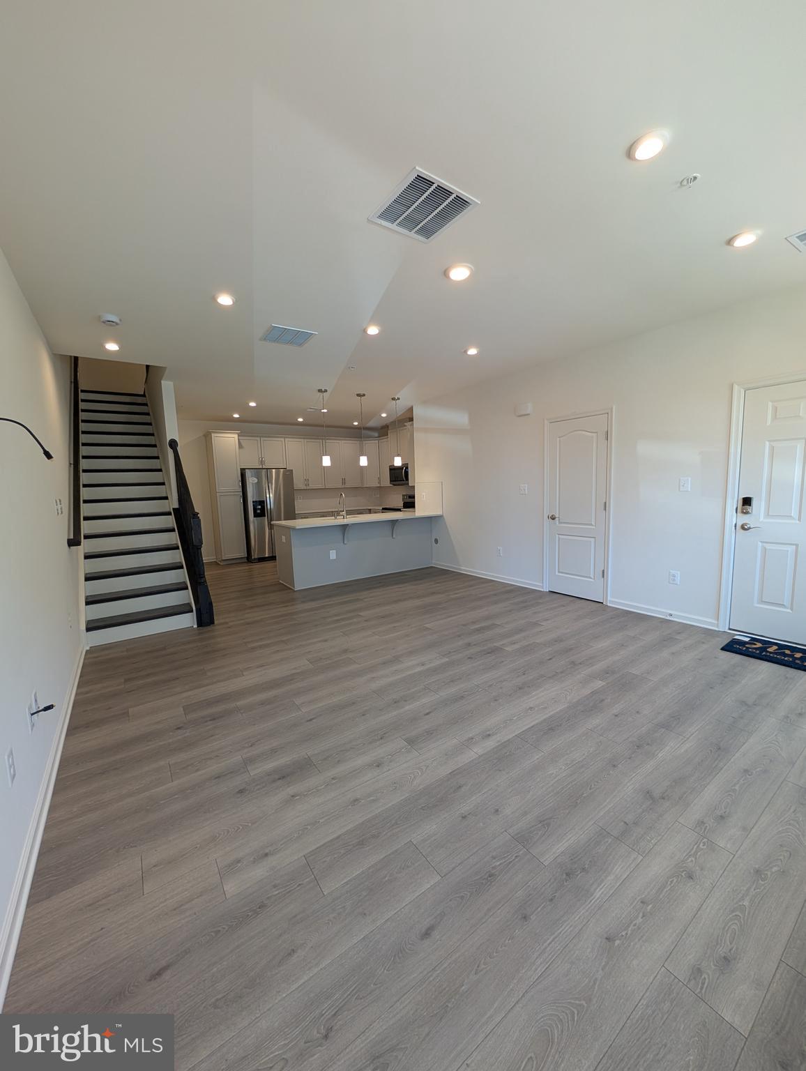 9985 A Justify Run Laurel, MD 20723 - Photo 7 of 33 an empty room with wooden floor