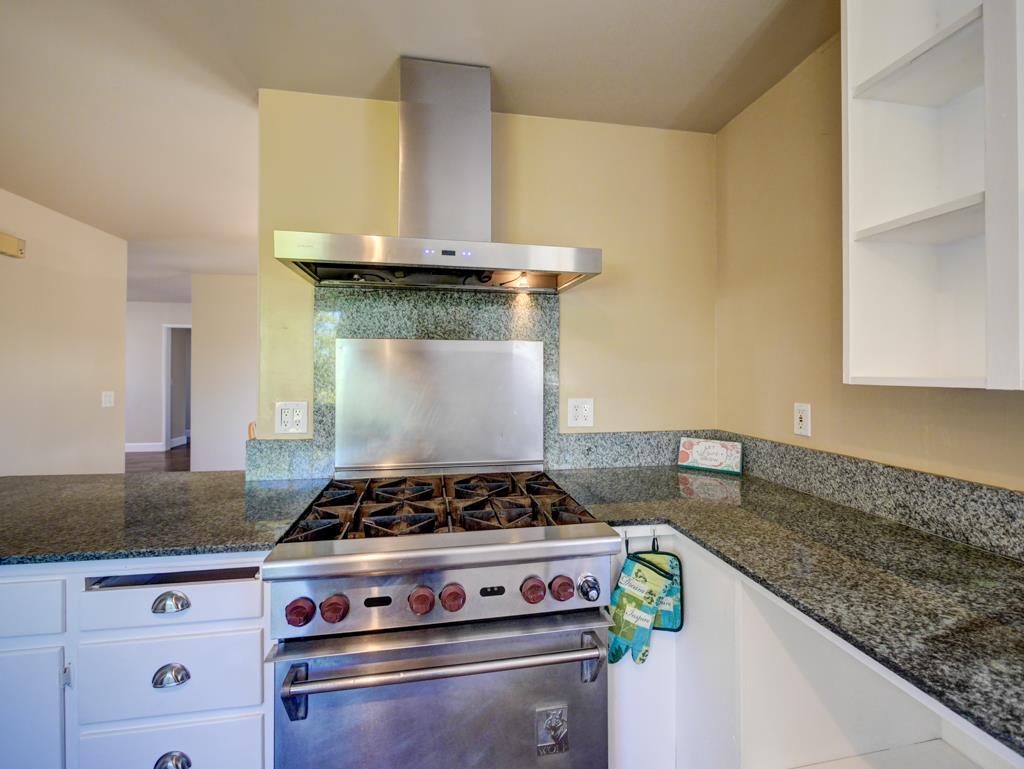 195 Corralitos View Road Watsonville, CA 95076 - Photo 6 of 34 a stove top oven sitting inside of a kitchen