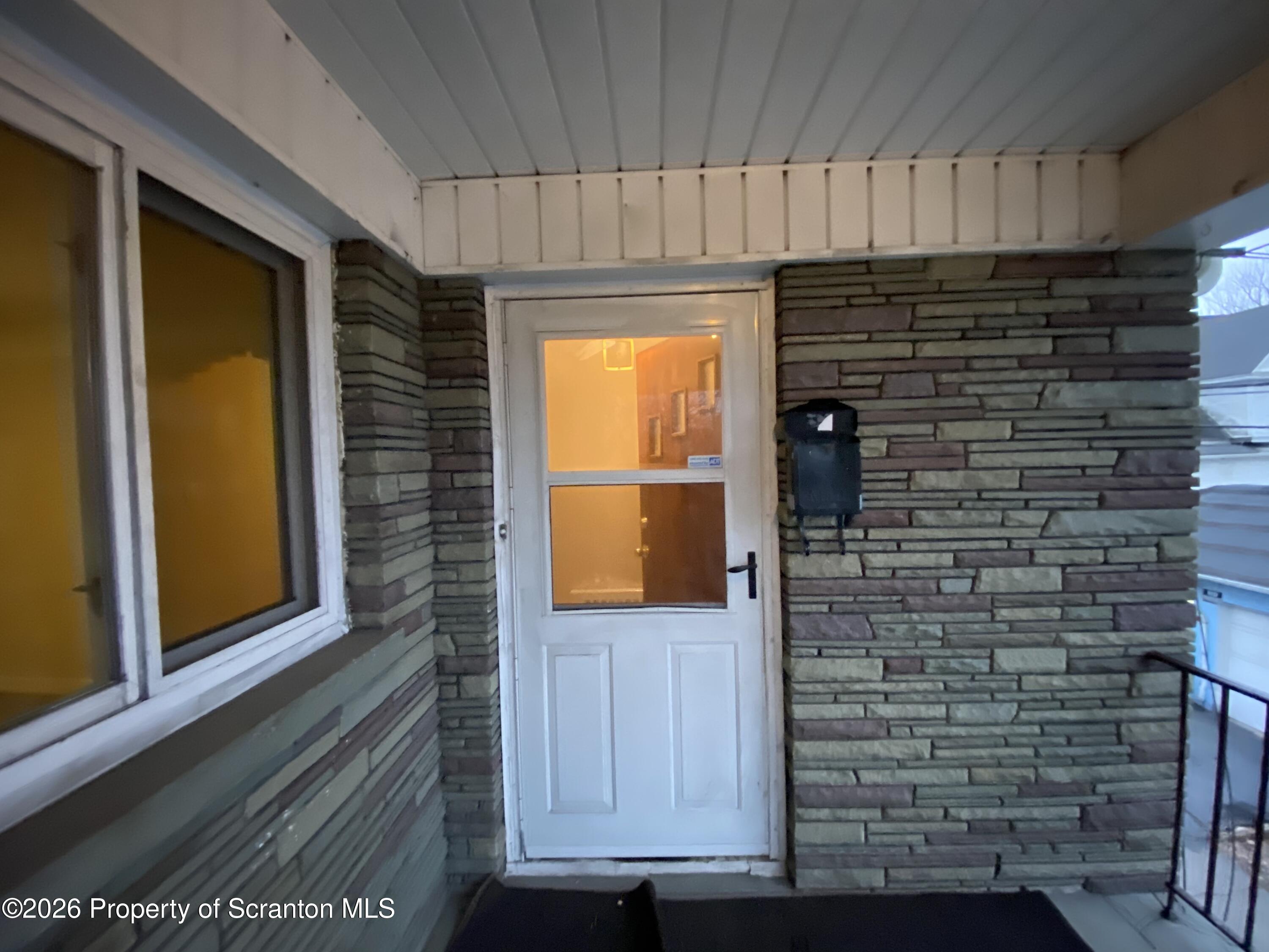 414 Orchard Street Scranton, PA 18505 - Photo 3 of 20 a bathroom with a window and a shower