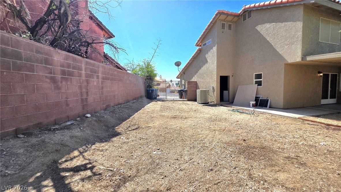 2155 Athol Way Laughlin, NV 89029 - Photo 18 of 19 A spacious backyard area awaits transformation, framed by durable block walls and stucco exterior.