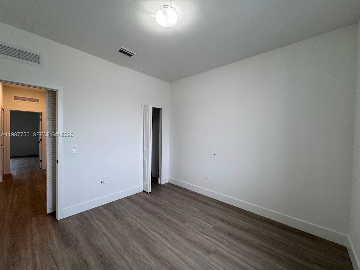 34435 Southwest 189th Court Homestead, FL 33030 - Photo 11 of 28 wooden floor in an empty room