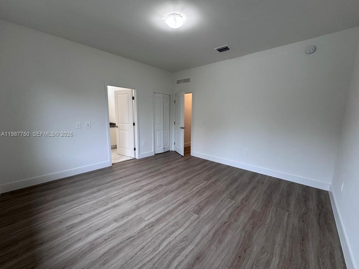 34435 Southwest 189th Court Homestead, FL 33030 - Photo 16 of 28 a view of empty room with wooden floor