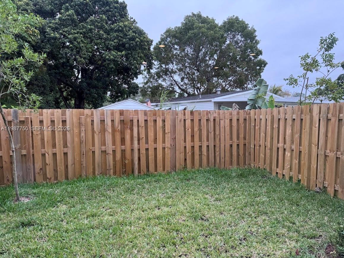 34435 Southwest 189th Court Homestead, FL 33030 - Photo 19 of 28 a view of backyard with wooden fences