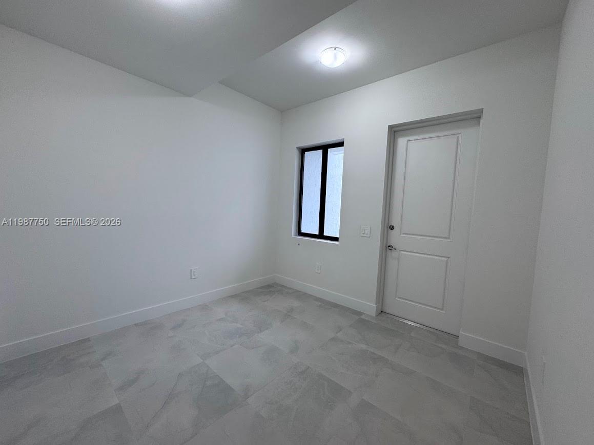 34435 Southwest 189th Court Homestead, FL 33030 - Photo 24 of 28 an empty room with windows and closet