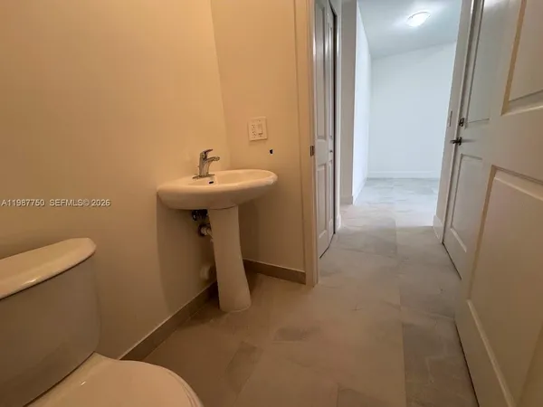 a view of room with stairs and a closet