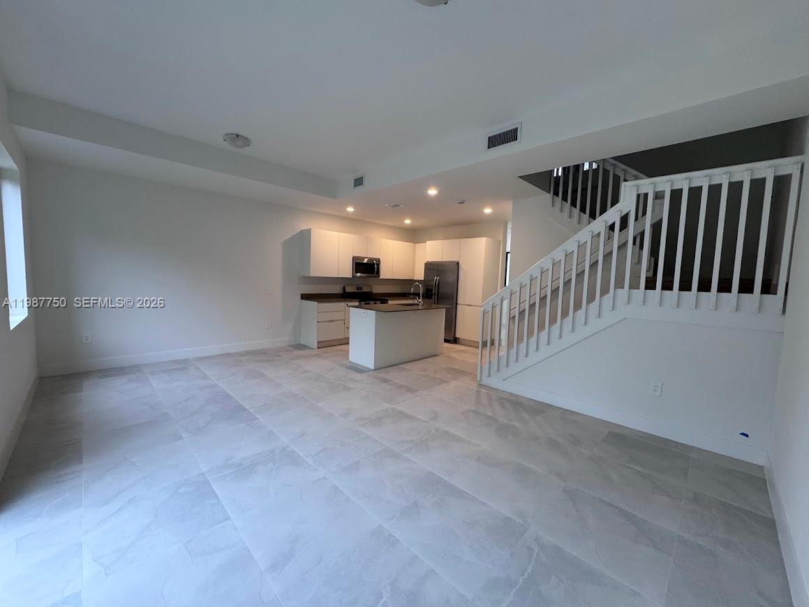 34435 Southwest 189th Court Homestead, FL 33030 - Photo 4 of 28 a view of a hallway with kitchen