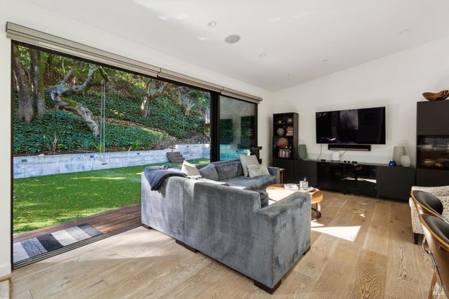 a living room with furniture and a swimming pool