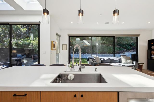a bathroom with a sink mirror and toilet