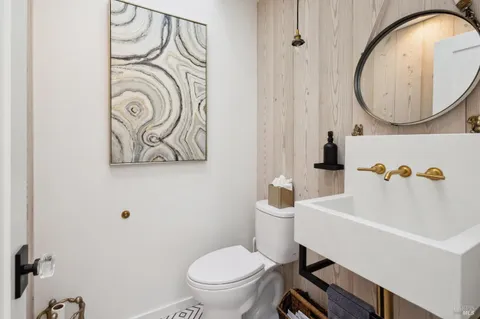 a bedroom with bed and a large window