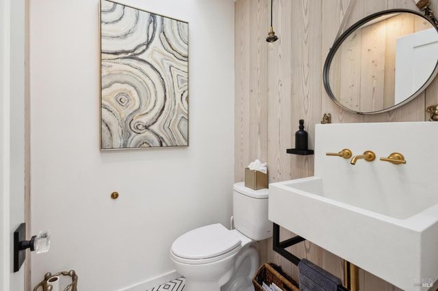 a bedroom with bed and a large window