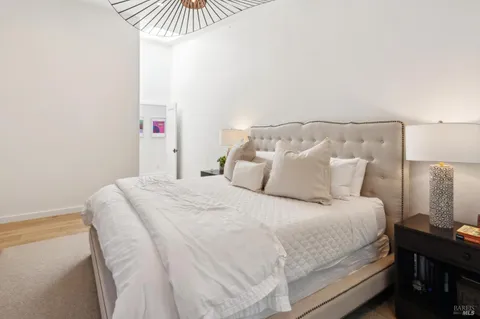 a bedroom with a bed and a couch