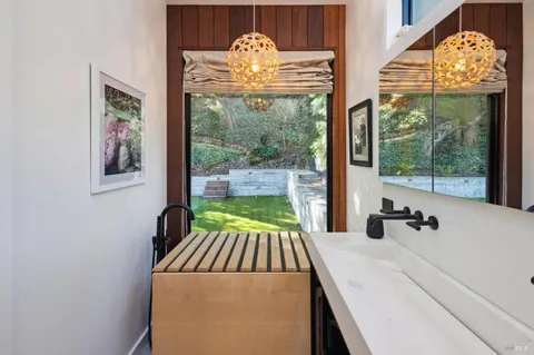 a bedroom with bed and a chandelier