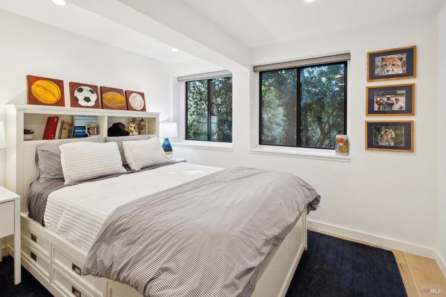 a bathroom with a painting on the wall and a shower